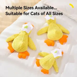 Three plush squeaky duck cat toys in different sizes on white bedding with catnip