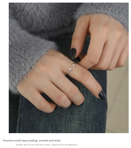 Detail of silver cat paw ring showing multi-layer plating and sparkling zircon stones