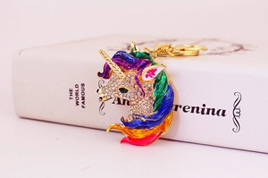 Detailed close-up of a unicorn keychain featuring colorful enamel and sparkling rhinestones