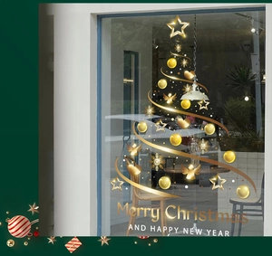 Detail of gold Christmas tree window decal with Merry Christmas text for shop glass