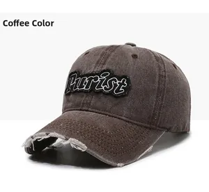 Close-up of distressed vintage coffee brown baseball cap with Purist embroidery details