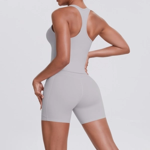 Rear view of a light grey racerback sports top and high-waist biker shorts set