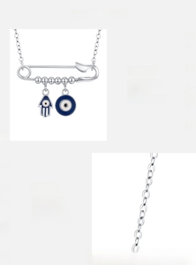 Detail of S925 sterling silver safety pin necklace with Hamsa Hand and Evil Eye charms