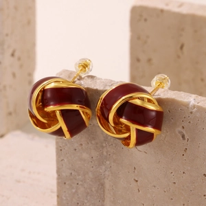 Elegant 18K gold plated red enamel woven knot stud earrings on a natural stone base