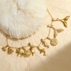 Golden stainless steel necklace featuring dolphin, seahorse, and elephant charms