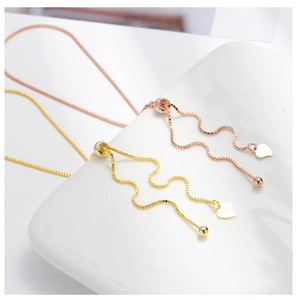 Macro shot of S925 sterling silver adjustable box chain details in gold and rose gold