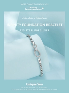 Detail view of a 925 sterling silver infinity bracelet on a soft blue display