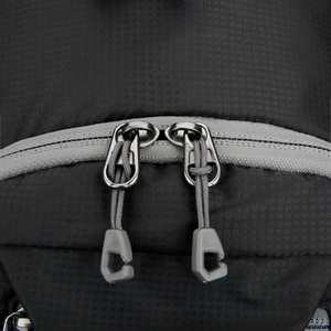 Macro view of dual-zipper system on black ripstop nylon outdoor waist bag for men