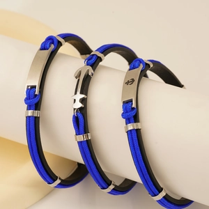 Set of three men's nautical anchor bracelets with leather cord and stainless steel clasp