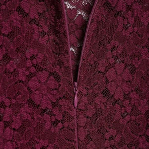 Elegant burgundy lace dress featuring a high collar and a concealed back zipper closure