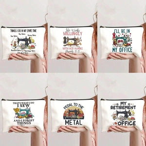 Detail showing various sewing themed prints on durable canvas makeup bags with black zippers