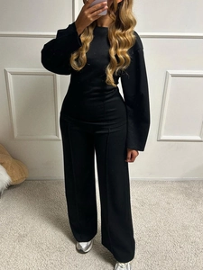Women's black casual two-piece set featuring long sleeve top and wide leg trousers