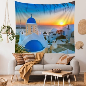 Detailed view of Santorini sunset tapestry hanging on a modern living room wall
