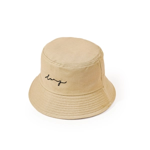 Detail view of khaki bucket hat with black handwritten embroidery on cotton fabric