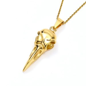 Detailed view of a golden eagle skull pendant on a thin metal chain for men