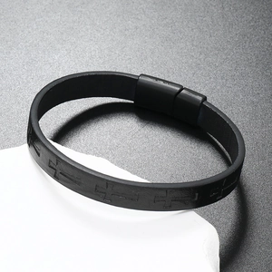 Close-up of black braided leather bracelet featuring a cross pattern and magnetic buckle