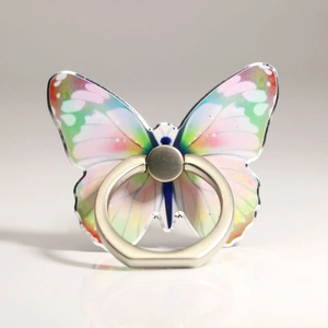 Detail of butterfly phone ring holder with pink and green gradient patterns and silver metal