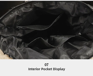 Interior view of the large tote bag showing a zipper pocket and dual open compartments