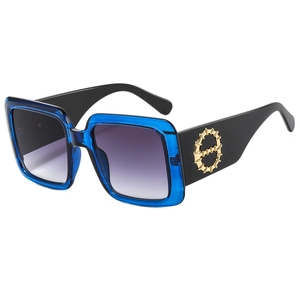 Fashionable oversized square sunglasses with blue transparent frames and gradient lenses