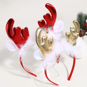 Detail of plush Christmas headbands with red and gold elk antlers and festive bell decorations