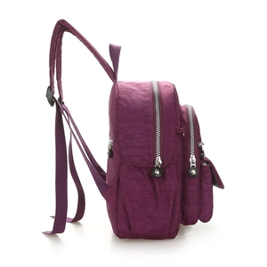 Minimalist purple nylon backpack with multiple compartments for travel and hiking