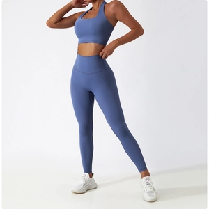 Detail of high-stretch seamless blue yoga set with halter sports bra and leggings