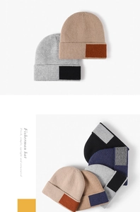 Detail of ribbed knit winter beanies showing contrast color patches and thick warm texture