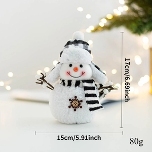 Detailed size view of plush snowman ornament with black and white plaid scarf and hat