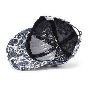 Internal view of paisley baseball cap with sweatband and adjustable metal buckle