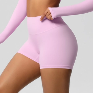 Detail of light pink high-waist fitness shorts showing butt-lifting and seamless fabric