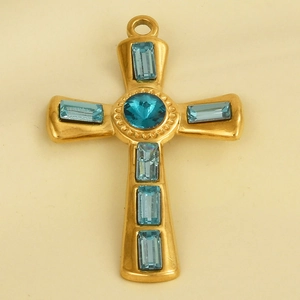 Detail of 304 stainless steel gold cross pendant with blue crystals and a central gem