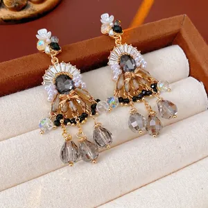 Vintage palace style pearl tassel earrings with gray crystal in a velvet jewelry box