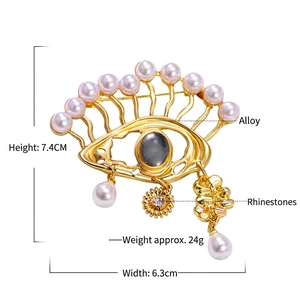 Evil Eye pendant brooch with gold plating, pearls and rhinestones, 7.4cm size