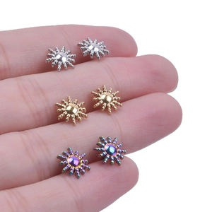 Detail view of 304 stainless steel sunburst stud earrings in silver gold and rainbow colors