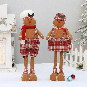 Christmas gingerbread doll pair with retractable legs and festive red plaid outfits