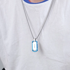 Men's titanium steel square pendant necklace in silver and blue worn by a male model