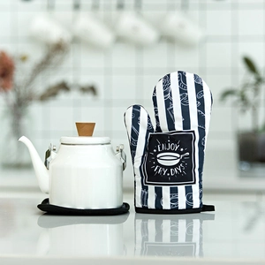 Thick black and white striped oven glove with Enjoy Fry-Days print in a kitchen setting