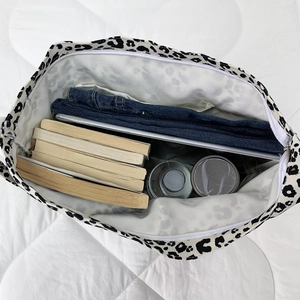 Top view of spacious leopard print tote showing interior pockets and large capacity