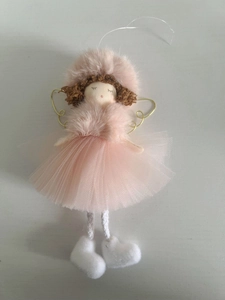 Detail of pink gauze tutu and golden wire wings on Christmas angel doll ornament