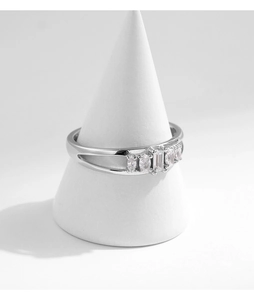Detail of S925 silver double-layered openwork ring with emerald-cut sparkling crystals