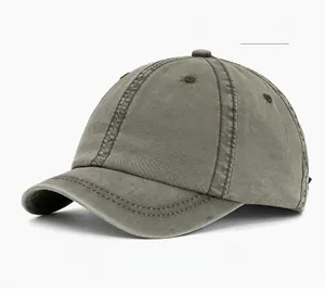 Detail of military green washed cotton baseball cap showing heavy canvas texture and stitching
