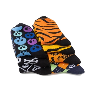 Detailed view of colorful crew socks featuring tiger stripes and skull patterns in soft cotton