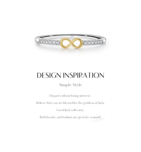 Macro shot of S925 sterling silver infinity ring featuring gold plating and pavé diamonds