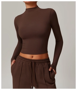 Detail of high-waist dark brown tracksuit set with drawstring pants and long sleeve top