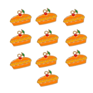 Detailed view of ten orange enamel pumpkin pie pendants with small cherry for DIY jewelry