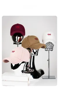 Detail of winter sherpa baseball caps with bow embroidery in four stylish colors
