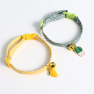 Detail of yellow mango and green cactus pendant pet collars with star pattern