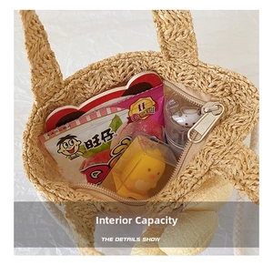 Internal capacity of children's straw bag showing storage space and zipper detail