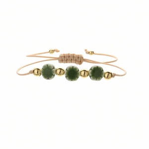 Handmade woven bracelet with dark green ceramic flower beads and golden accents
