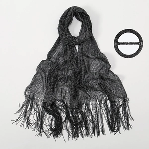 Sparkling black lurex shawl for evening dresses featuring long tassels and a matching buckle